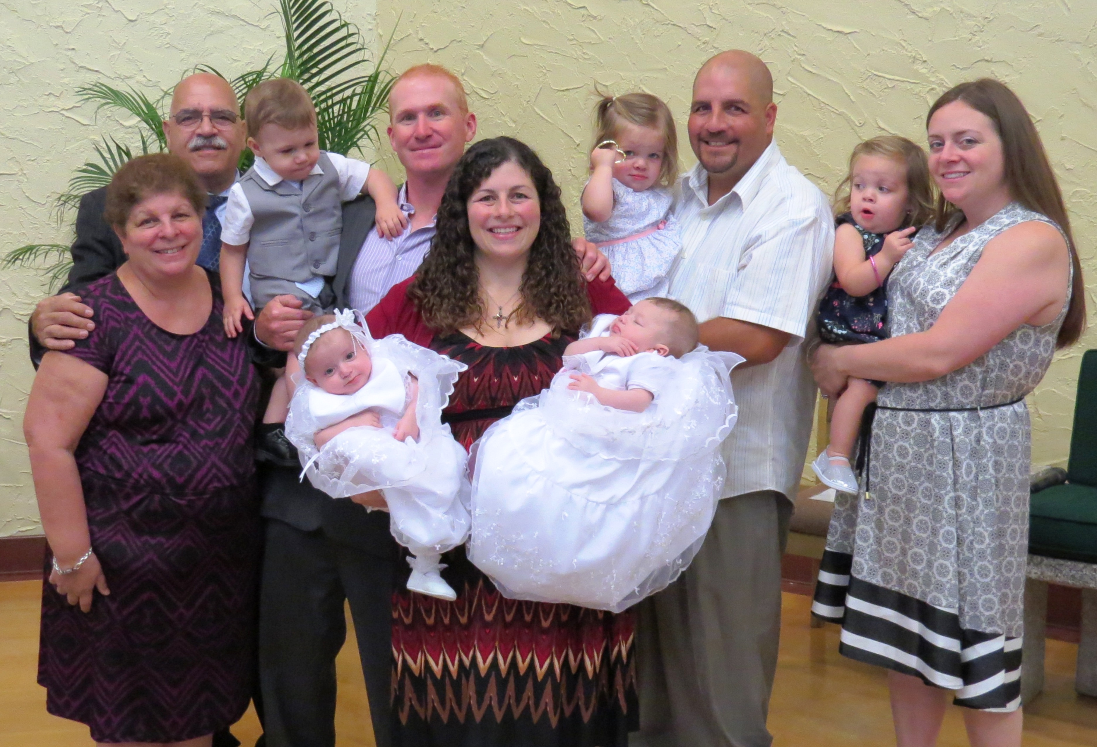 Left to right: Josephine Facilla, John Facilla, Hunter Brignoli, Tom Brignoli, Donna-Marie Brignoli, Sophia Facilla, John A. Facilla, Ava Facilla, Denise Facilla, and in the arms of Donna-Marie, Charli and Brooke Brignoli. alt text