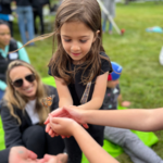 Camper releasing butterfly
